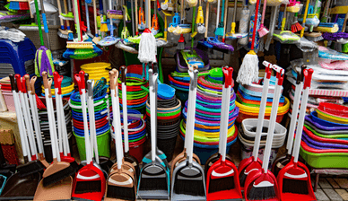 Picture of cleaning supplies including brooms, mops and buckets