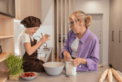 Mother and daughter prepping food together